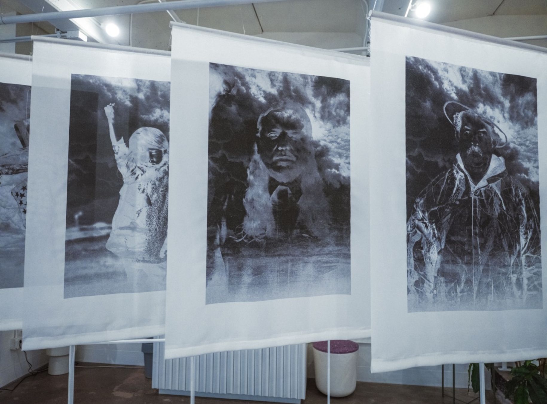 Josue's three art banners hanging in gallery