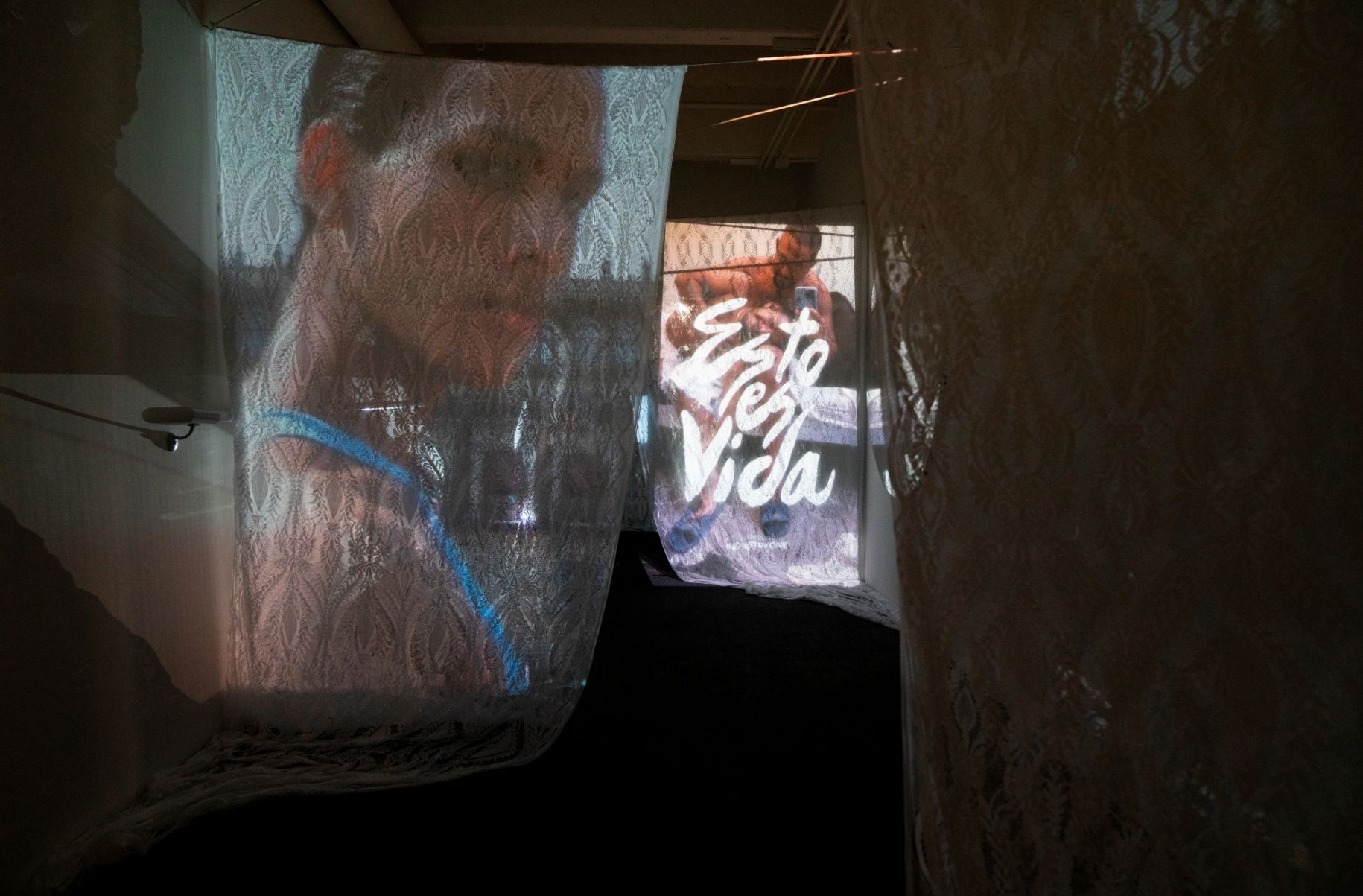 Projection room showing Dorian's work projected onto sheer fabric