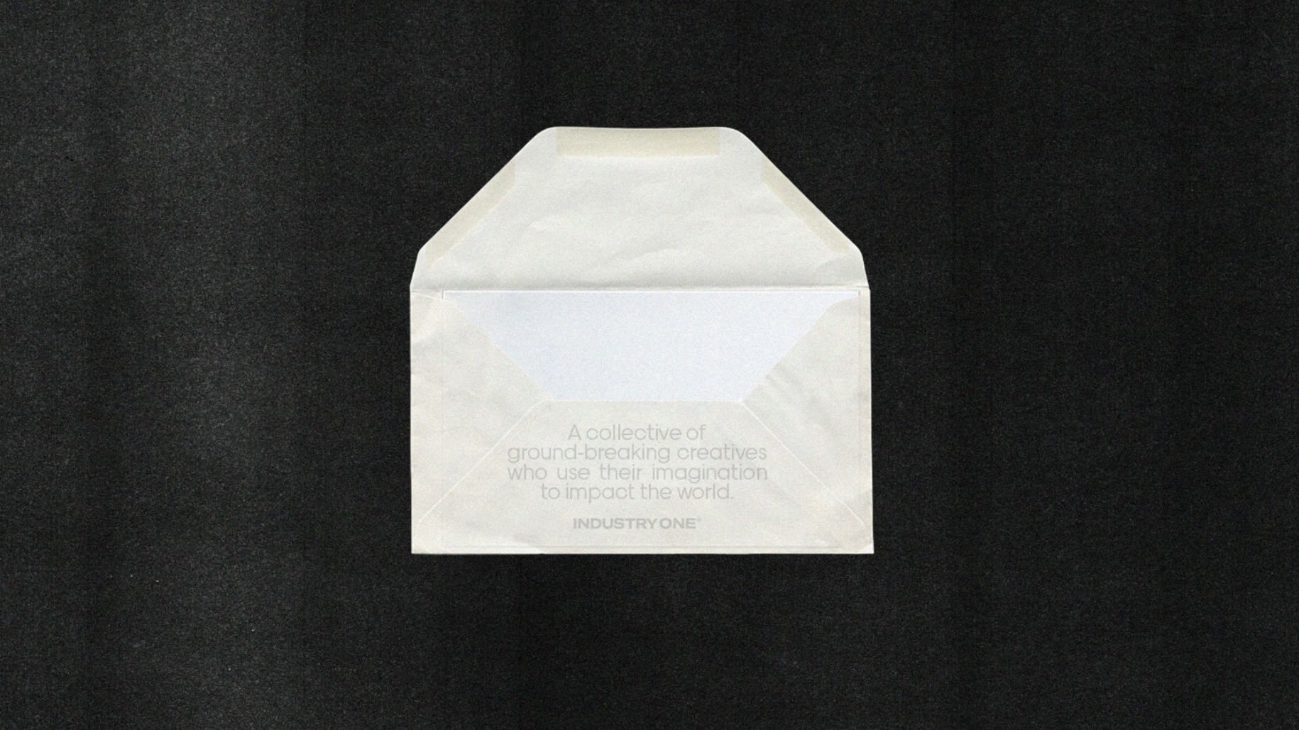 Envelope with the print on it reading: A collective of ground-breaking creatives who use their imagination to impact the world.